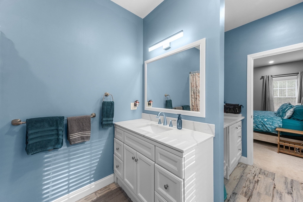 85 Waterhouse Road Bourne, MA 02532 - Photo 20 of 28 a bathroom with a sink and a mirror