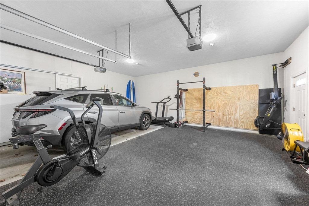 85 Waterhouse Road Bourne, MA 02532 - Photo 21 of 28 a view of a garage with cars