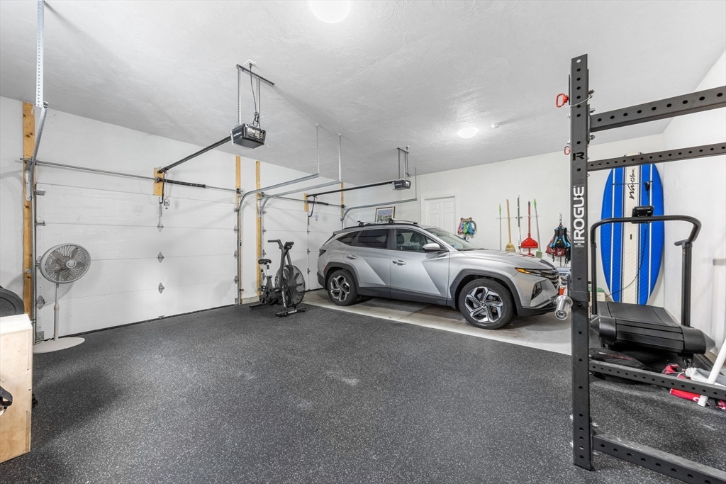 85 Waterhouse Road Bourne, MA 02532 - Photo 22 of 28 a view of a garage and car parked