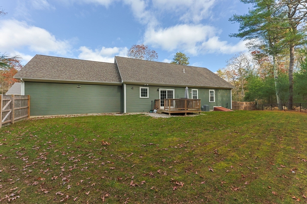 85 Waterhouse Road Bourne, MA 02532 - Photo 24 of 28 a front view of a house with a garden