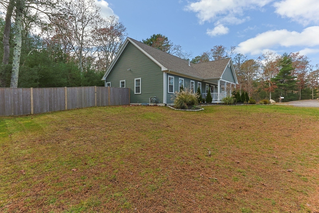 85 Waterhouse Road Bourne, MA 02532 - Photo 25 of 28 a view of a house with a yard