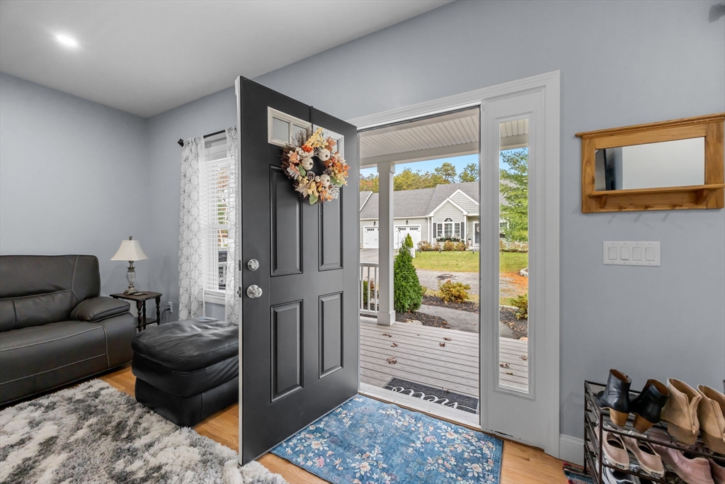 85 Waterhouse Road Bourne, MA 02532 - Photo 3 of 28 a living room with furniture and a gate