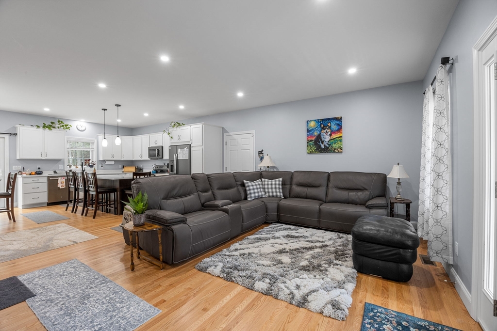 85 Waterhouse Road Bourne, MA 02532 - Photo 4 of 28 a living room with furniture and kitchen view