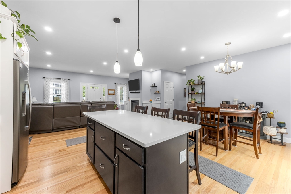 85 Waterhouse Road Bourne, MA 02532 - Photo 9 of 28 a large kitchen with a table and chairs