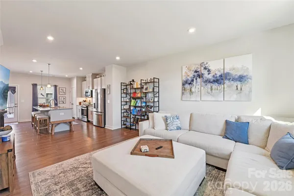 a living room with furniture and a table