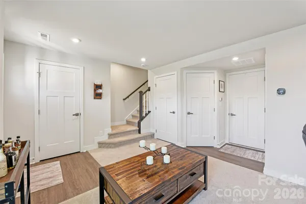 a living room with a bed furniture and a window