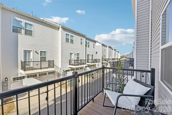 a view of a balcony with chairs