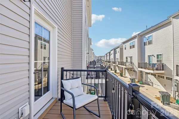 a view of a balcony with furniture
