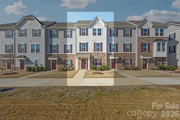 a view of multiple houses with a street