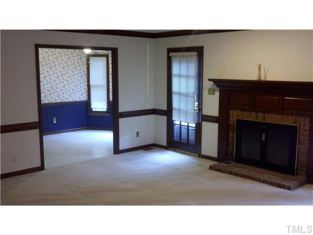 4613 Old Village Road Raleigh, NC 27612 - Photo 2 of 6 a living room with furniture and a fireplace