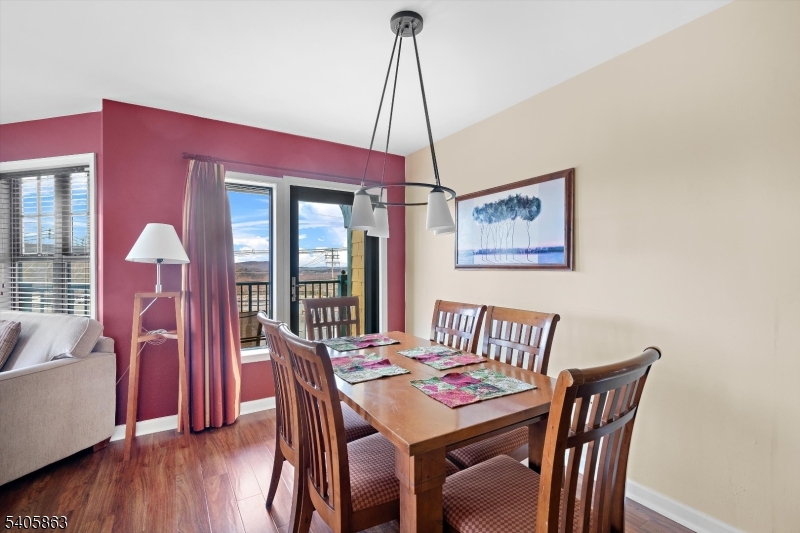 200 Highway 94, Unit 249 Vernon, NJ 07462 - Photo 12 of 28 a view of a dining room with furniture window and wooden floor