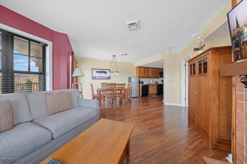 200 Highway 94, Unit 249 Vernon, NJ 07462 - Photo 20 of 28 a living room with furniture and wooden floor