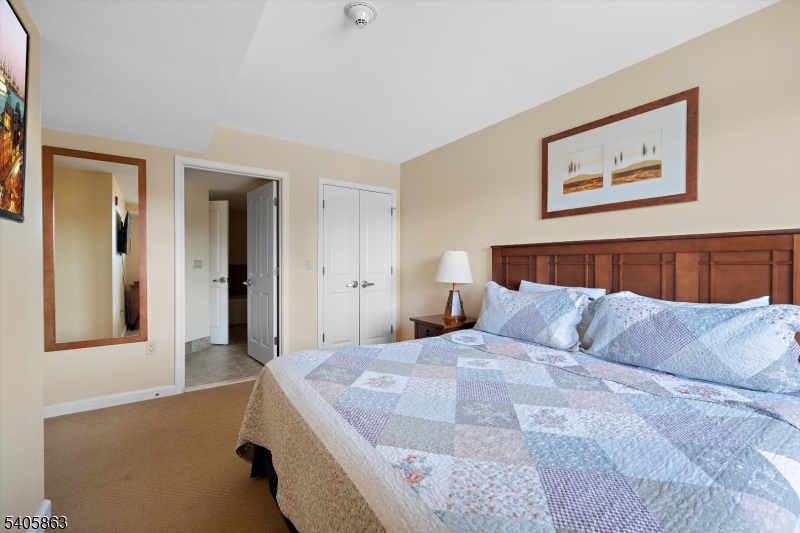 200 Highway 94, Unit 249 Vernon, NJ 07462 - Photo 22 of 28 a bedroom with a bed and a couch