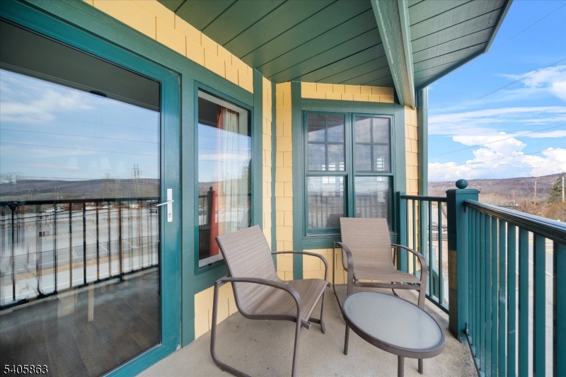 200 Highway 94, Unit 249 Vernon, NJ 07462 - Photo 27 of 28 a balcony with table and chairs