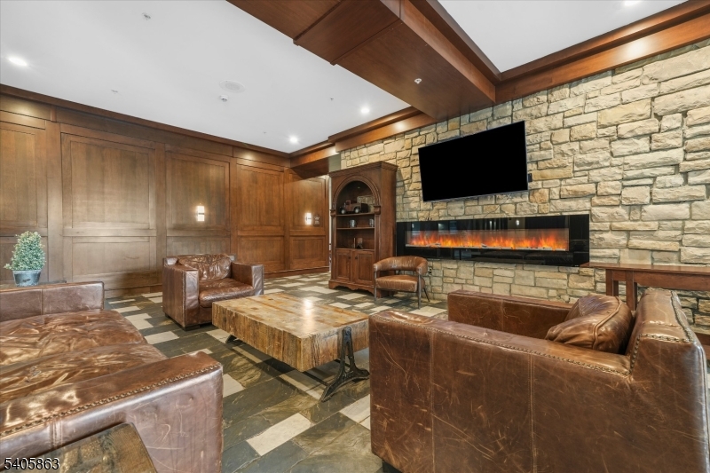 200 Highway 94, Unit 249 Vernon, NJ 07462 - Photo 3 of 28 a living room with furniture and a flat screen tv