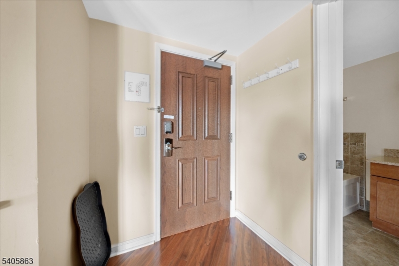 200 Highway 94, Unit 249 Vernon, NJ 07462 - Photo 8 of 28 a view of a hallway with wooden floor and closet area