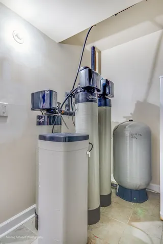 a front view of a house with garden and chairs