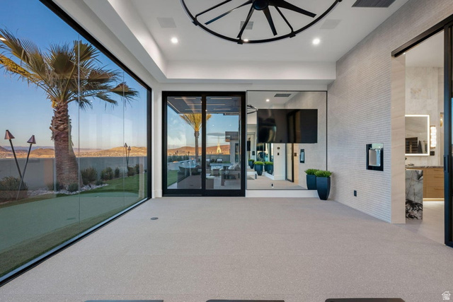 2867 East Granite Way St. George, UT 84790 - Photo 38 of 69 Expansive floor-to-ceiling glass wall, light gray carpet flooring, recessed lighting, and a modern ceiling fixture
