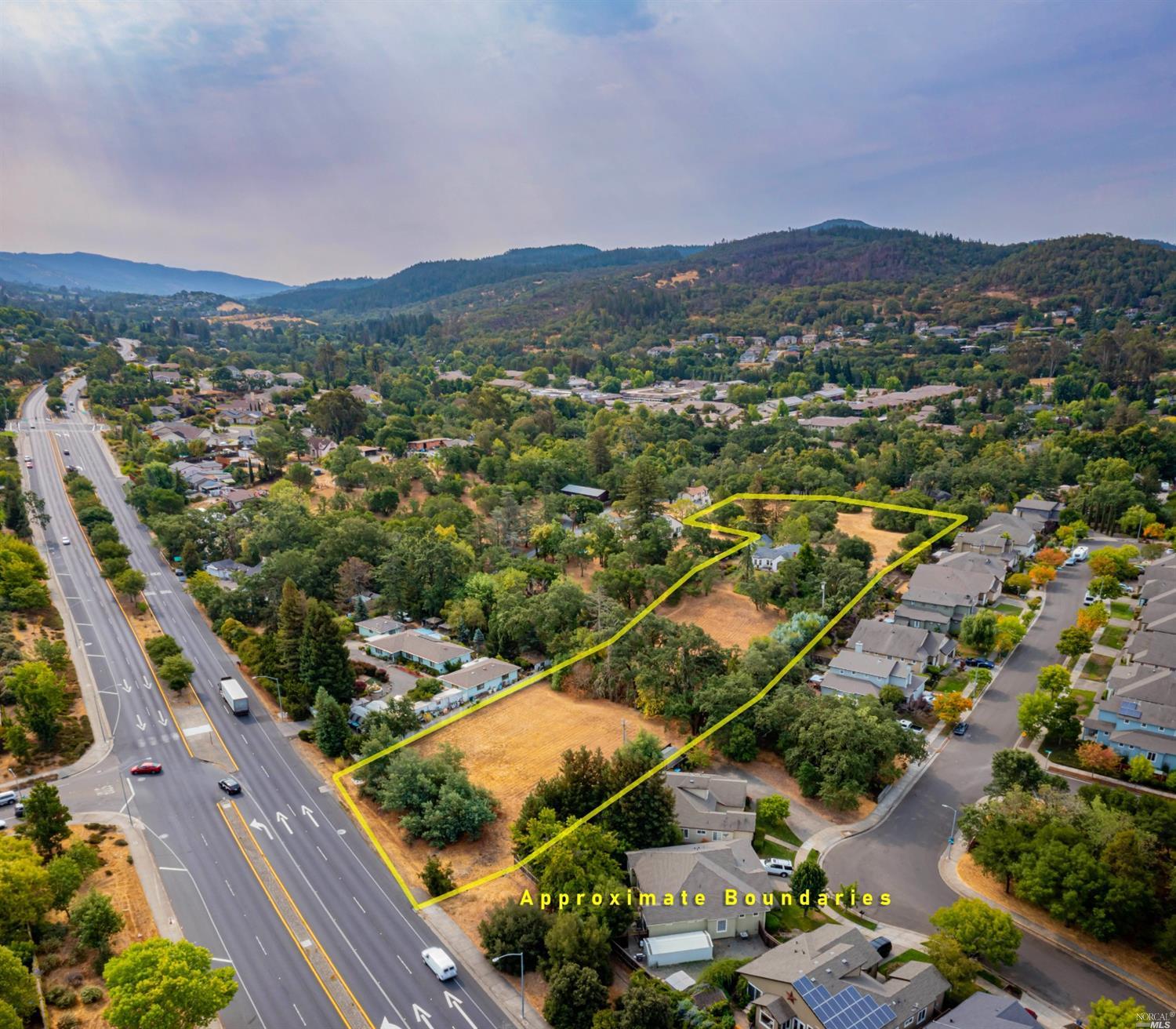 an aerial view of residential houses with outdoor space
