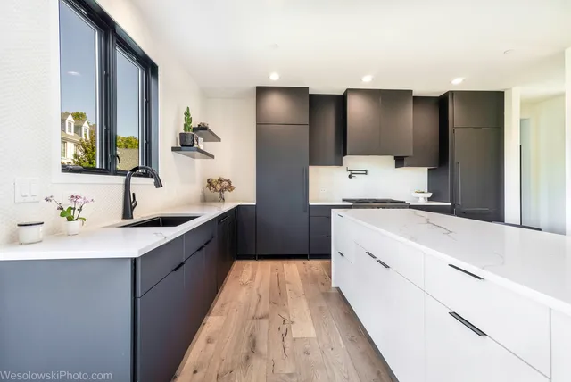 a large bathroom with a double vanity sink and mirror