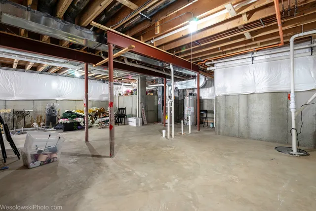 a view of a roof deck with table and chairs a barbeque with wooden floor and fence