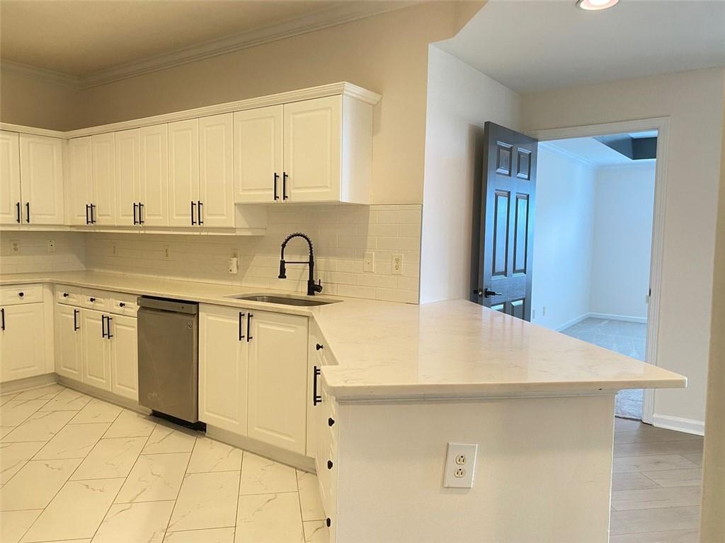3047 Lenox Road Northeast, Unit 1202 Atlanta, GA 30324 - Photo 14 of 69 a kitchen with a sink cabinets and appliances