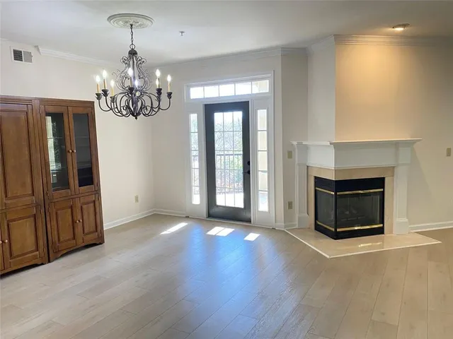 a view of an empty room and a window