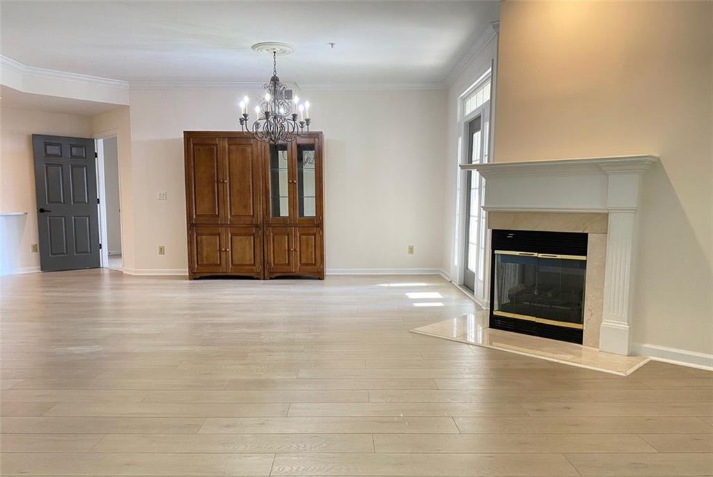 3047 Lenox Road Northeast, Unit 1202 Atlanta, GA 30324 - Photo 23 of 69 an empty room with fireplace and windows