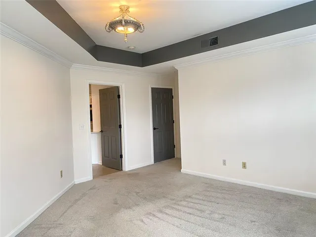a bathroom with a granite countertop toilet a sink and bathtub