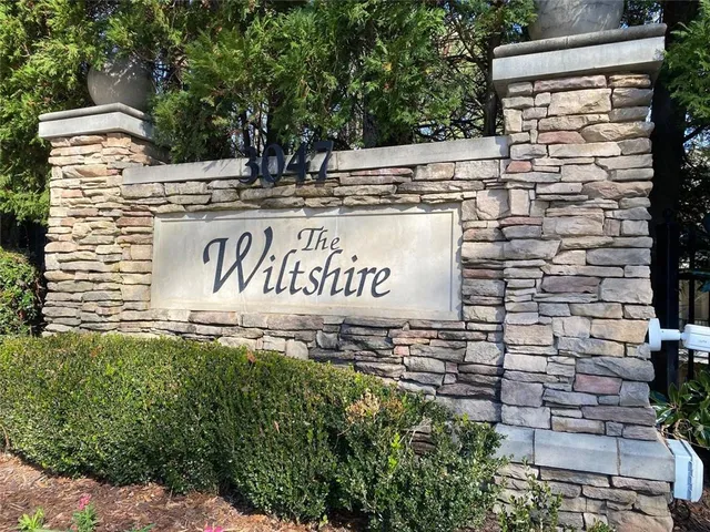 a view of outdoor space with garden and trees