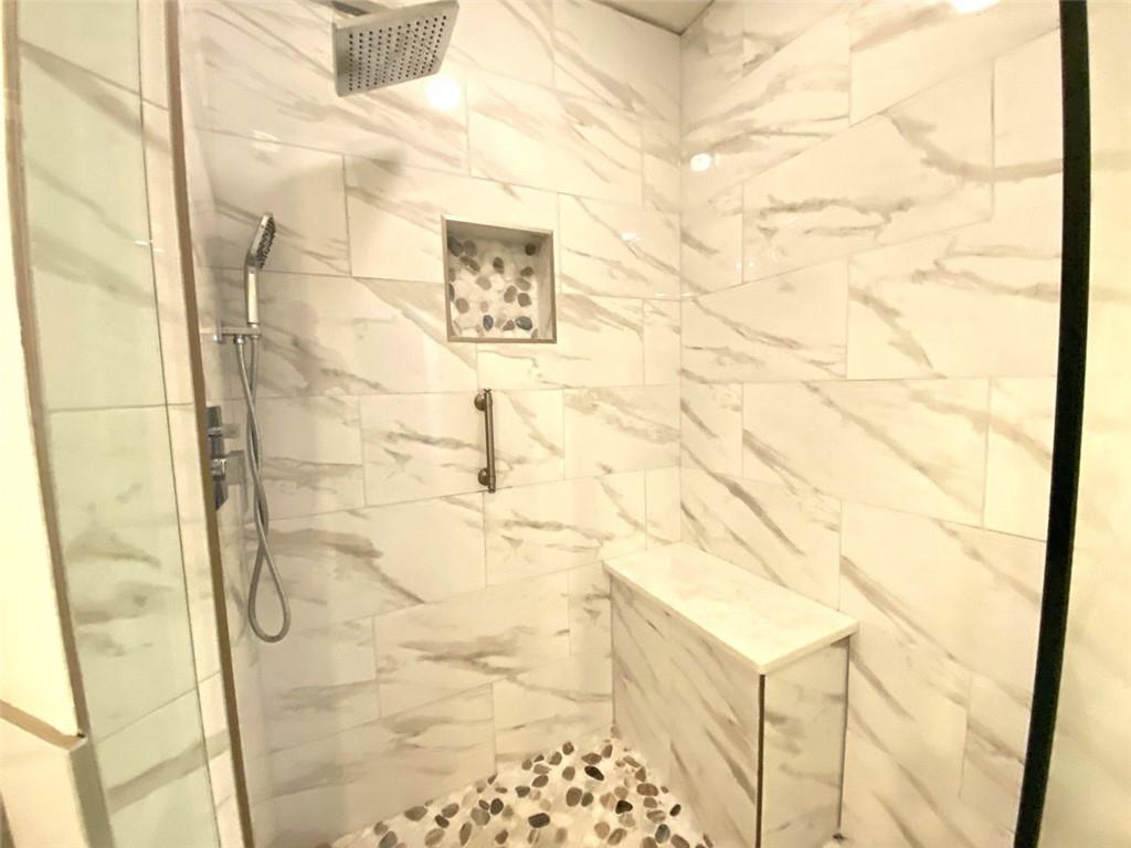 3047 Lenox Road Northeast, Unit 1202 Atlanta, GA 30324 - Photo 33 of 69 a bathroom with a shower
