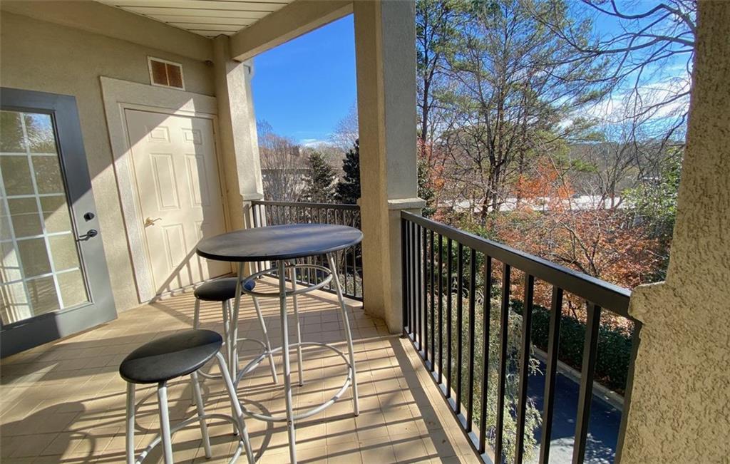 3047 Lenox Road Northeast, Unit 1202 Atlanta, GA 30324 - Photo 47 of 69 a view of a balcony with chairs