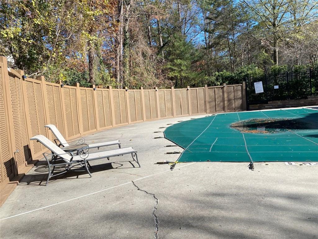 3047 Lenox Road Northeast, Unit 1202 Atlanta, GA 30324 - Photo 52 of 69 a view of a backyard with a bench