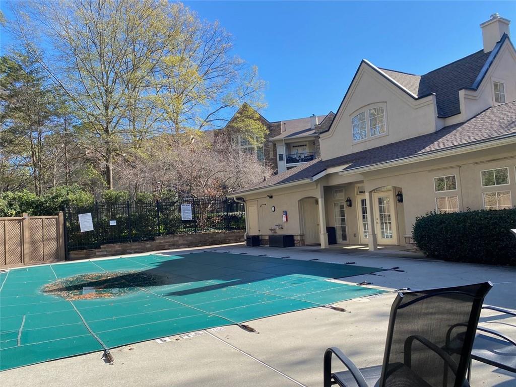 3047 Lenox Road Northeast, Unit 1202 Atlanta, GA 30324 - Photo 53 of 69 a front view of house with yard and green space