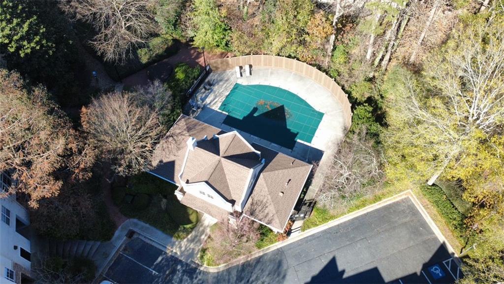 3047 Lenox Road Northeast, Unit 1202 Atlanta, GA 30324 - Photo 63 of 69 an aerial view of a house with a yard and large trees