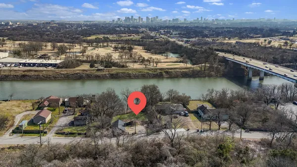 an aerial view of a house with a lake view