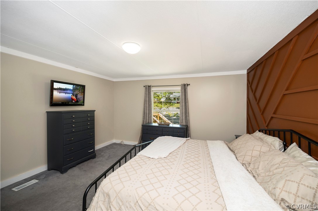 3634 Shirleys Hill Road Partlow, VA 22534 - Photo 12 of 22 a bedroom with a bed and a flat screen tv