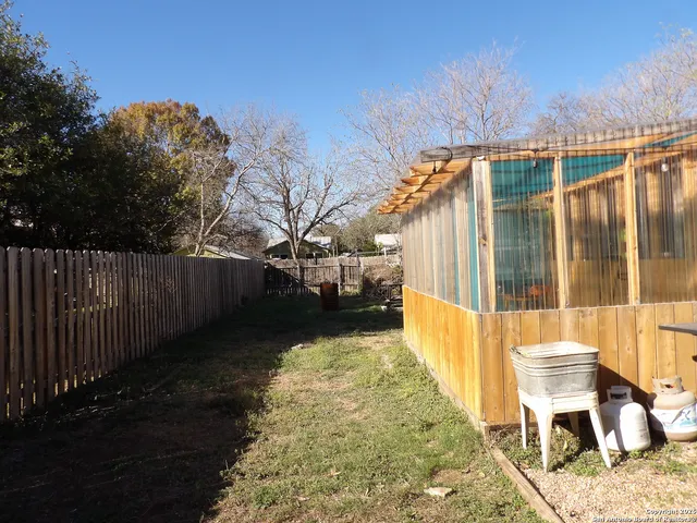a view of a balcony with chairs
