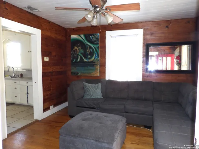 a living room with furniture and a window