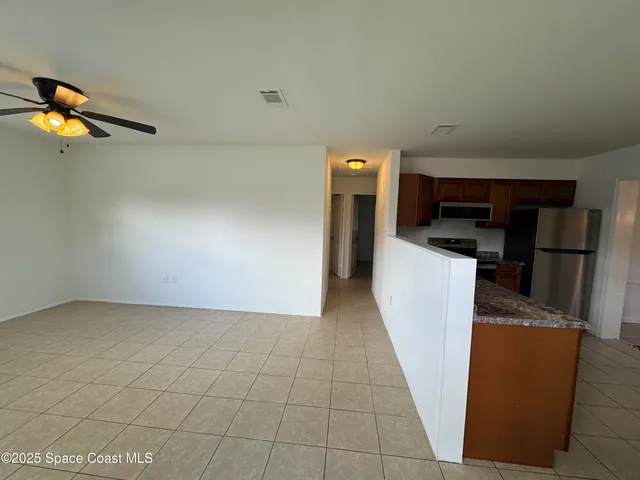 a view of a storage & utility room with two washing machine