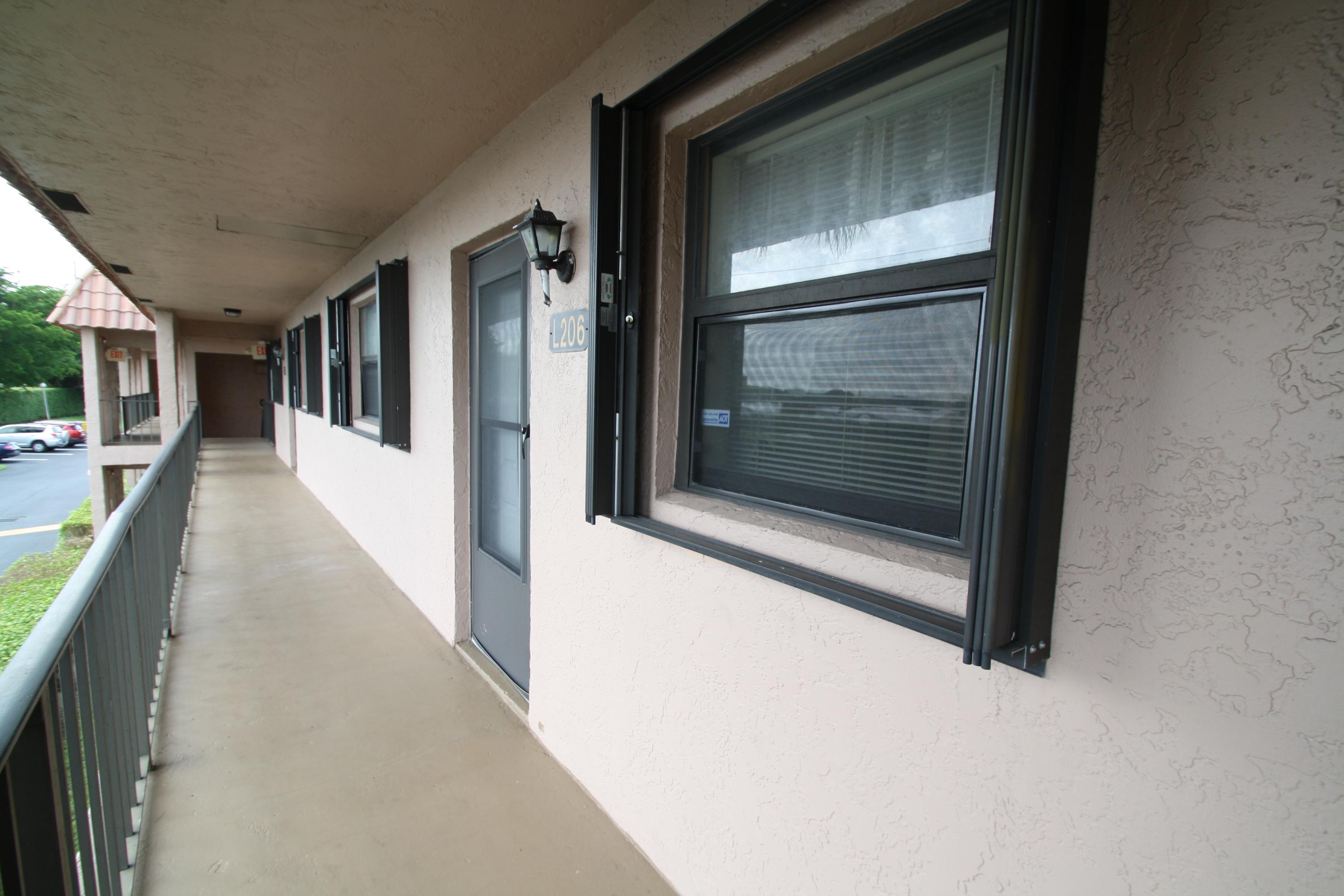 2141 Woolbright Road, Unit L206 Boynton Beach, FL 33426 - Photo 19 of 19 Accordian Shutters