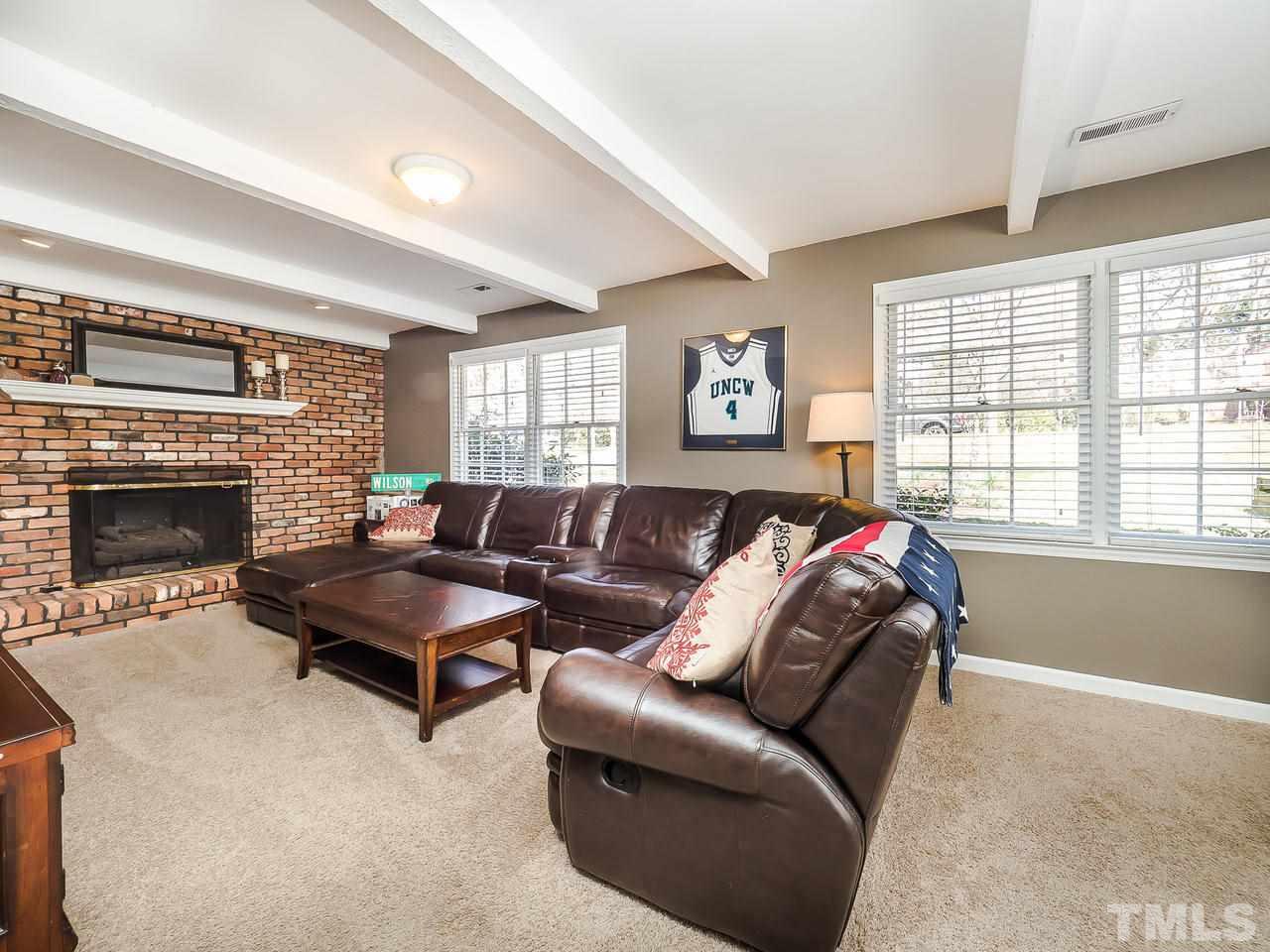 2002 Port Royal Road Raleigh, NC 27609 - Photo 13 of 23 a living room with furniture and a fireplace