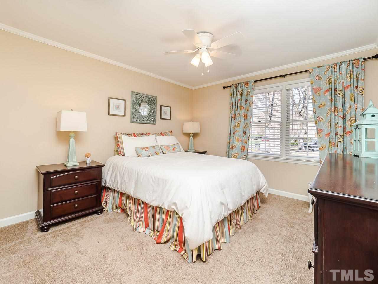 2002 Port Royal Road Raleigh, NC 27609 - Photo 18 of 23 a bed room with a bed and a night stand