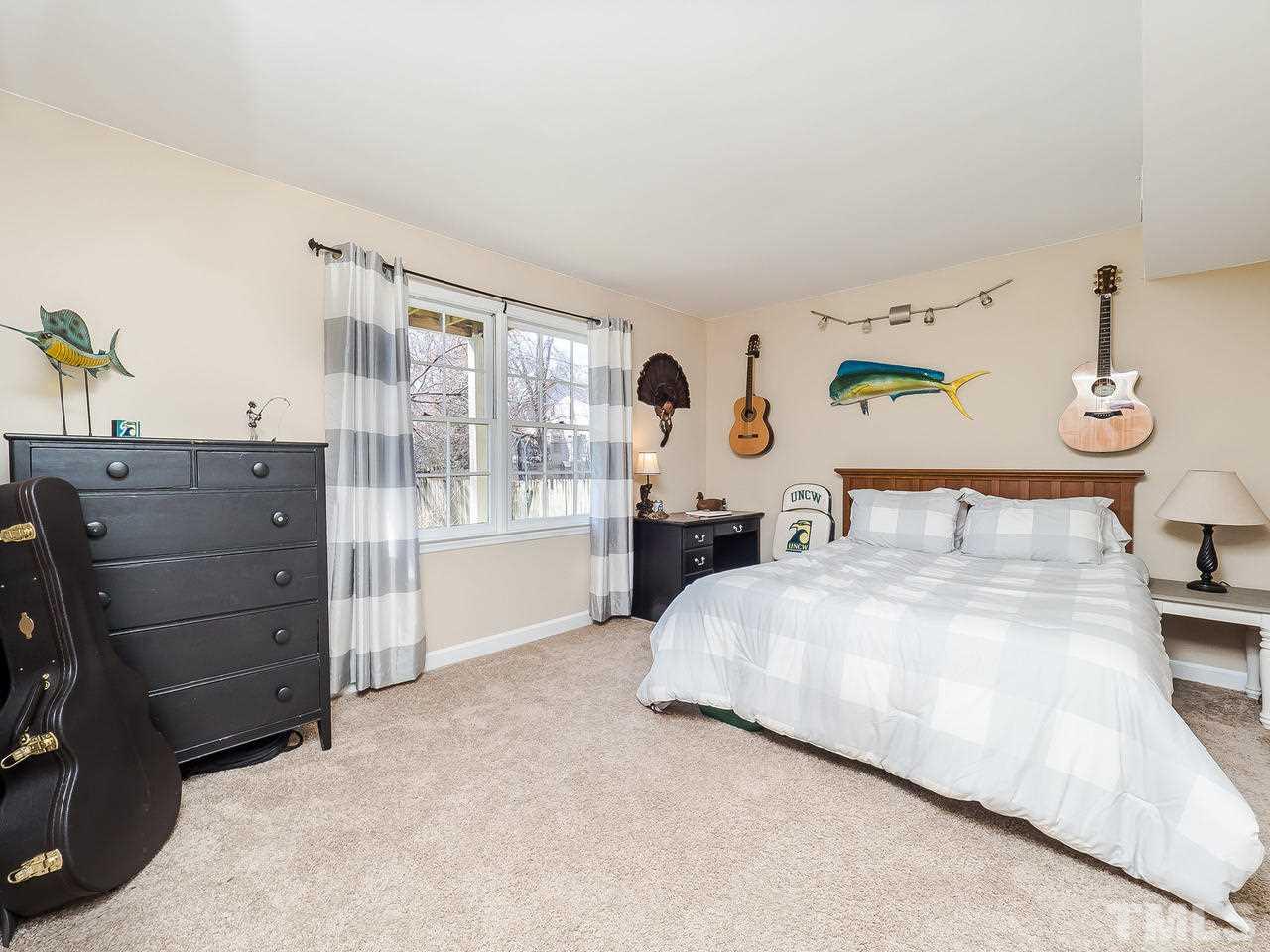 2002 Port Royal Road Raleigh, NC 27609 - Photo 19 of 23 a spacious bedroom with a bed and with furniture
