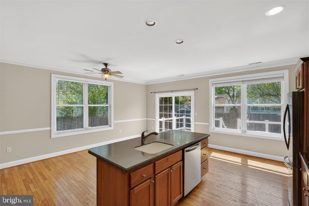 1604 Oriole Road Edgewater, MD 21037 - Photo 14 of 29 a kitchen with stainless steel appliances granite countertop a sink a stove and a large window