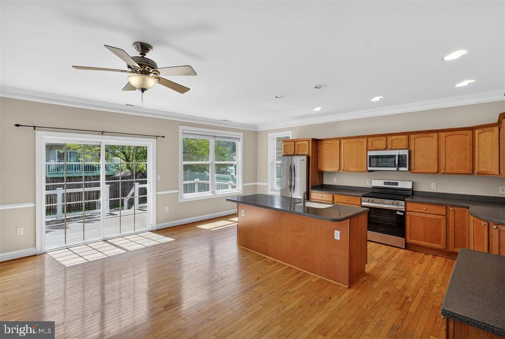 1604 Oriole Road Edgewater, MD 21037 - Photo 15 of 29 a open kitchen with stainless steel appliances granite countertop a stove and a wooden floors