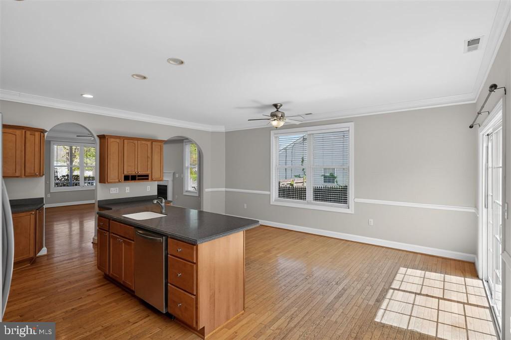 1604 Oriole Road Edgewater, MD 21037 - Photo 16 of 29 a kitchen with stainless steel appliances granite countertop a sink a stove and a wooden floors