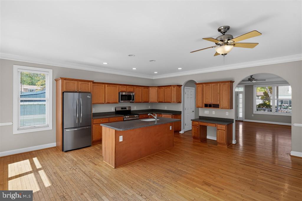1604 Oriole Road Edgewater, MD 21037 - Photo 18 of 29 a kitchen with stainless steel appliances granite countertop a refrigerator a stove and a wooden floors