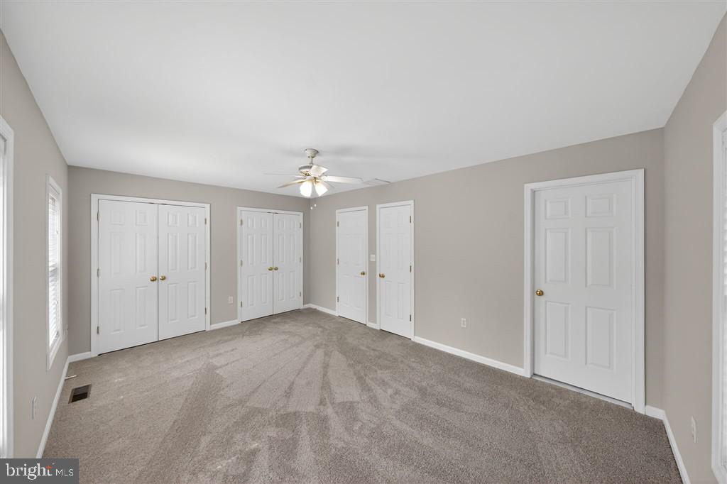 1604 Oriole Road Edgewater, MD 21037 - Photo 19 of 29 a view of an empty room with a ceiling fan
