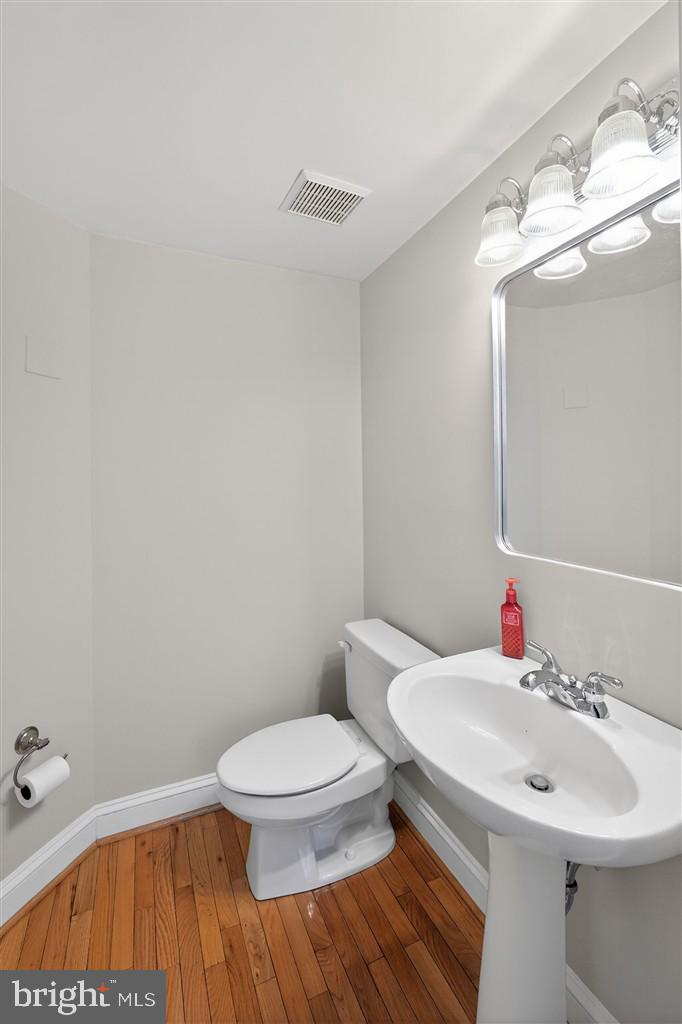1604 Oriole Road Edgewater, MD 21037 - Photo 21 of 29 a bathroom with a sink a toilet and mirror